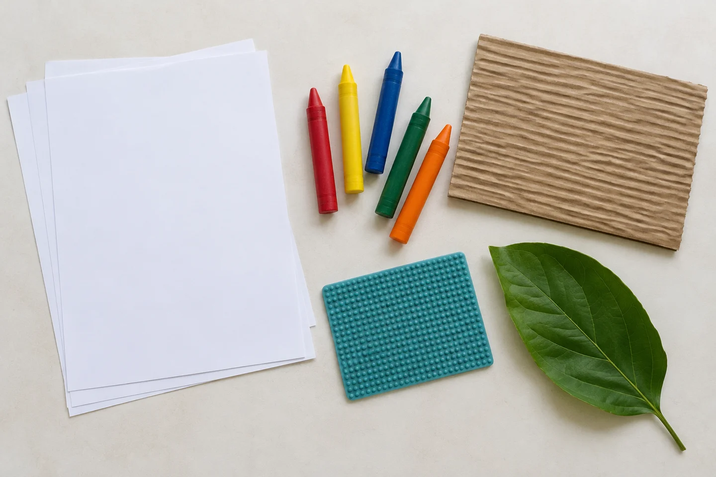 Light paper, crayons and safe textured surfaces for rubbing.