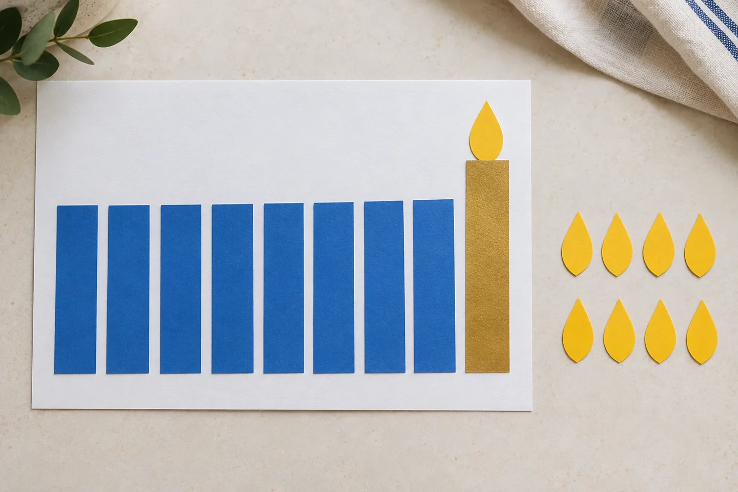 Eight blue paper candles and a separate gold shamash with loose flame shapes